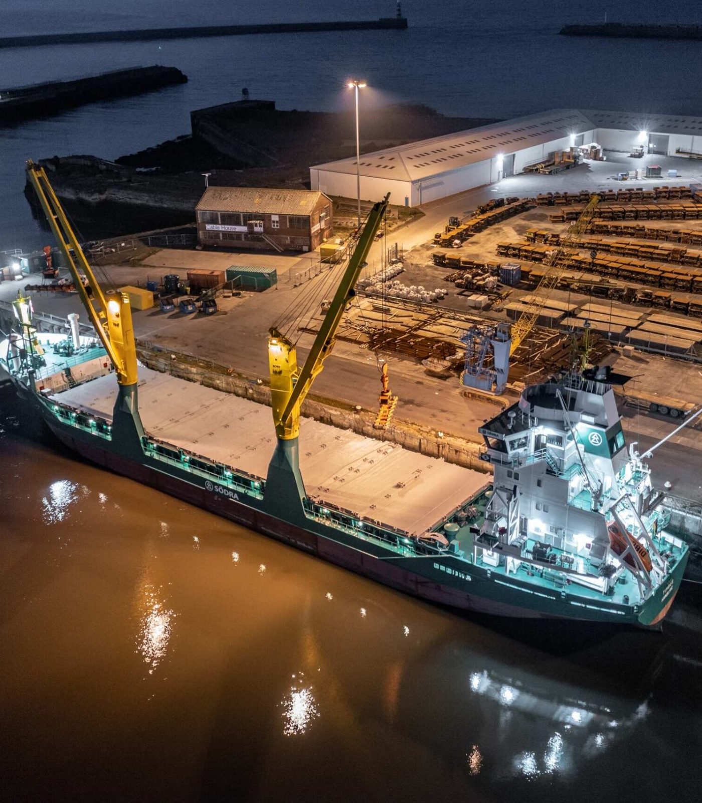 cargo-ship-at-a-port-at-night-offloading-cargo-and-2022-11-17-15-42-16-utc cargo-ship-at-a-port-at-night-offloading-cargo-and-2022-11-17-15-42-16-utc